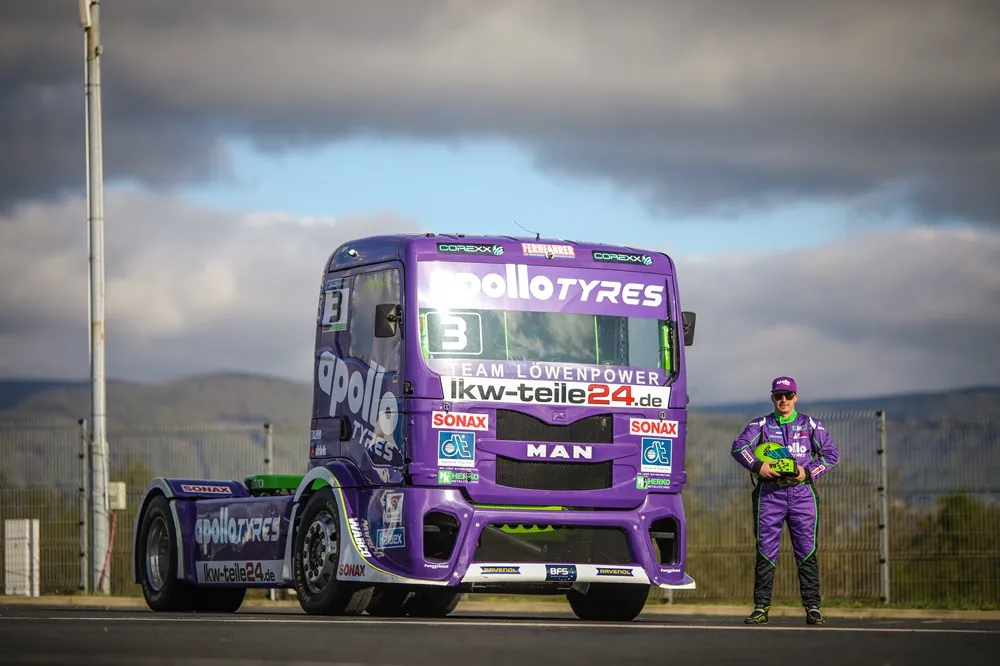 Purple racing truck with Apollo Tyres sponsorship