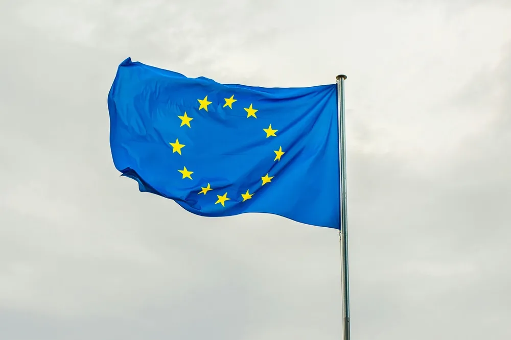 European flag flowing left with a sky background
