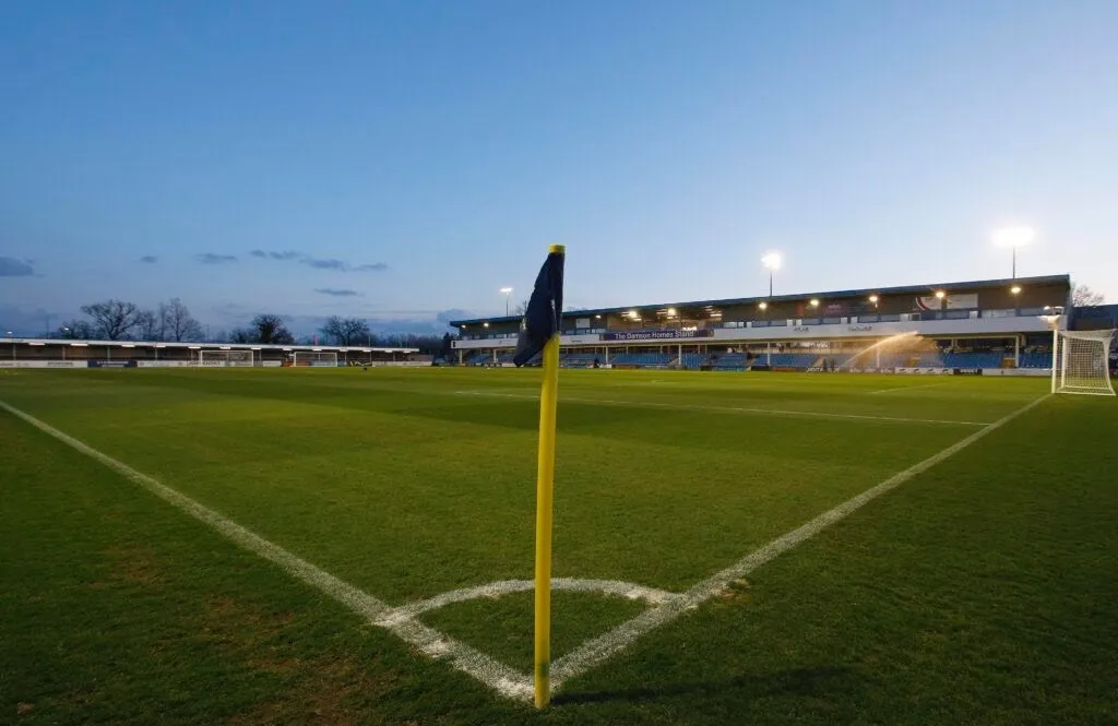 Photo of a football pitch taken from the view of a corner flag