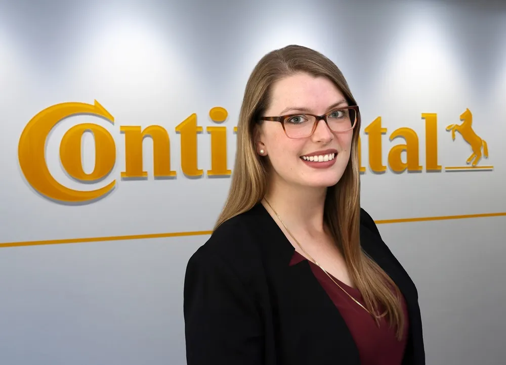 Photo of Lisa Reiners in front of the Continental logo