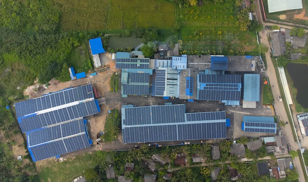 Top Image of ATIREs Carbon Neutral factory with solar panels on roof