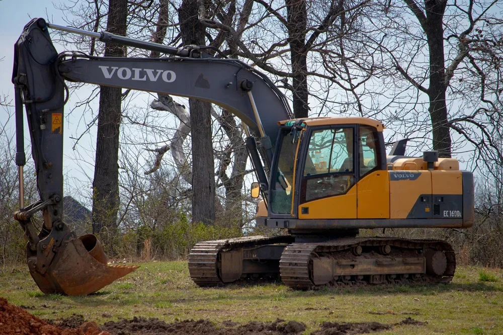 Image of a Volvo tracked digger in a field