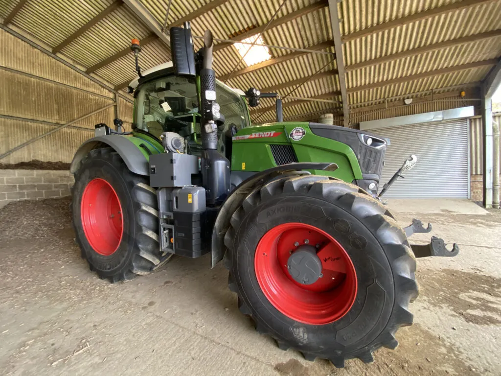 DS JE King Son green tractor in barn with Michelin AxioBib 2 tyres