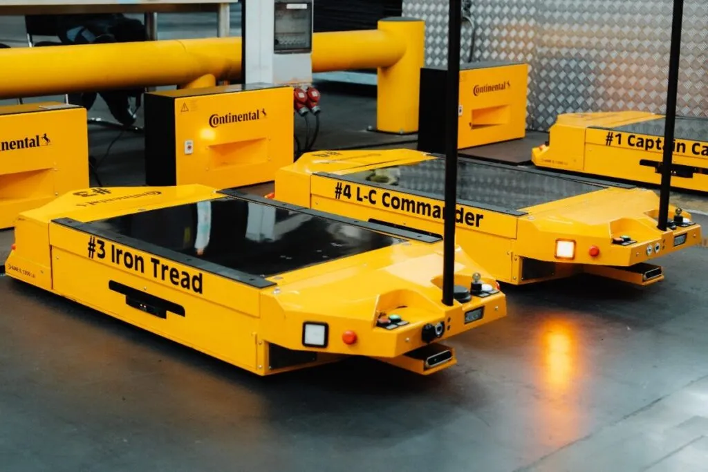 Image of three AMRs in yellow at Continental's factory