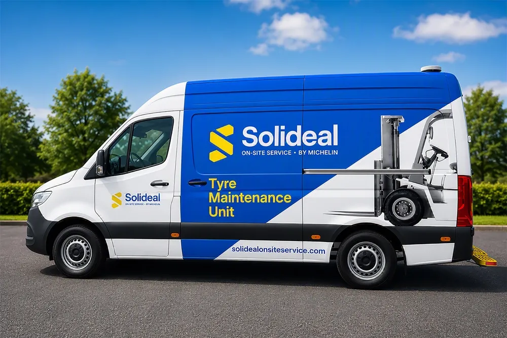 Image of Solideal On-Site Service by Michelin van side view. The Mercedes Sprinter van is white and view. Parked on tarmac with a blue sky.